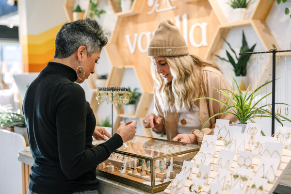 Vanilla Threads shop owner with jewelry in the Old Mill District, photographed by Gwen Shoemaker
