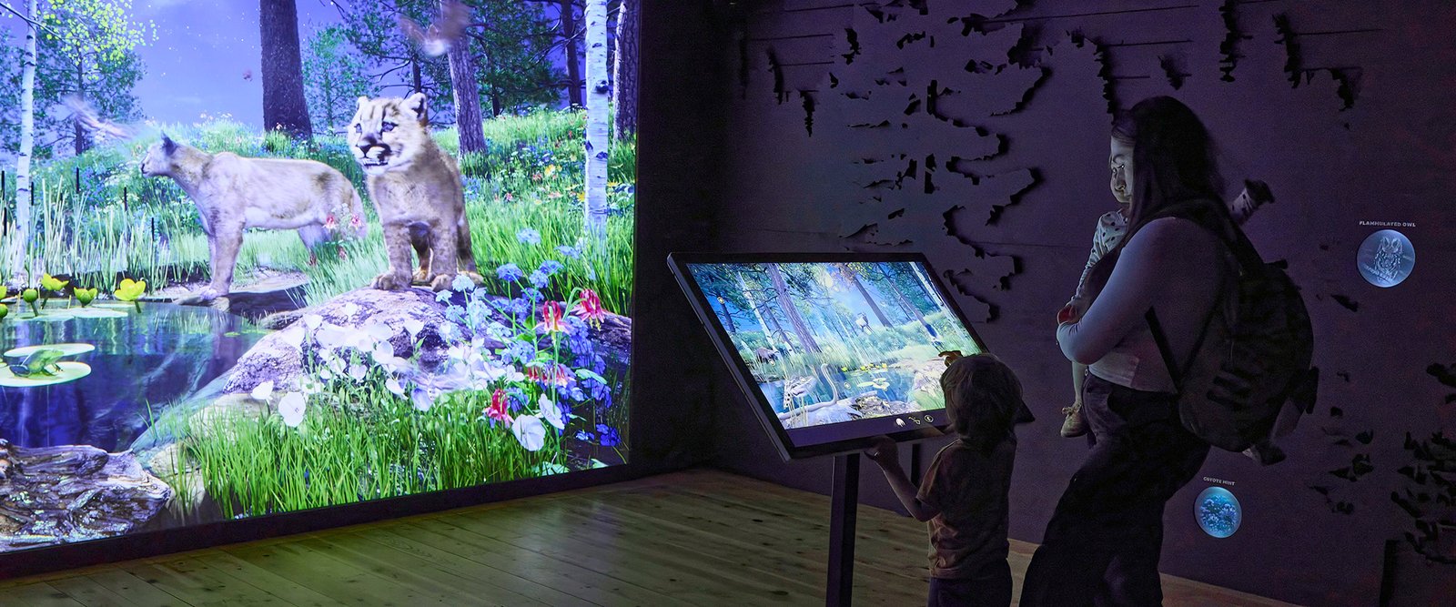 Family in the High Desert Museum’s Forest at Night exhibit, photographed by Abbott Schindler